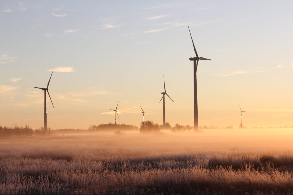 Photo Of Windmills During Dawn  by Laura Penwell