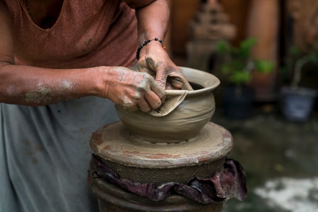 Woman Making Clay Pot by Quang Nguyen Vinh