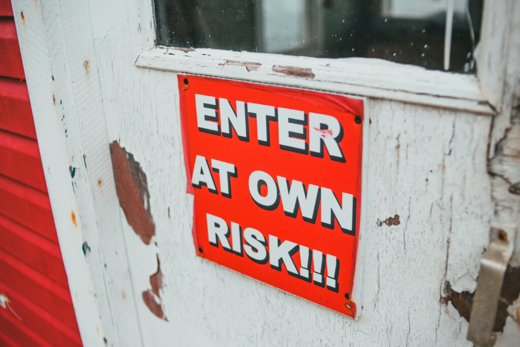 A Warning Sign on a Door by Erik Mclean