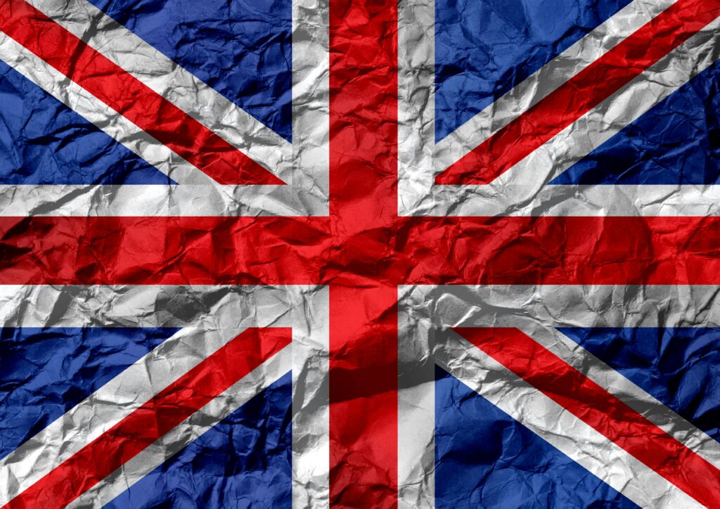 UK flag on creased paper by vectors icon