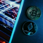 Bitcoin and Ethereum coins beside market screen image