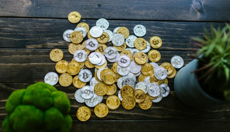 Cryptocurrency coins on wooden table image